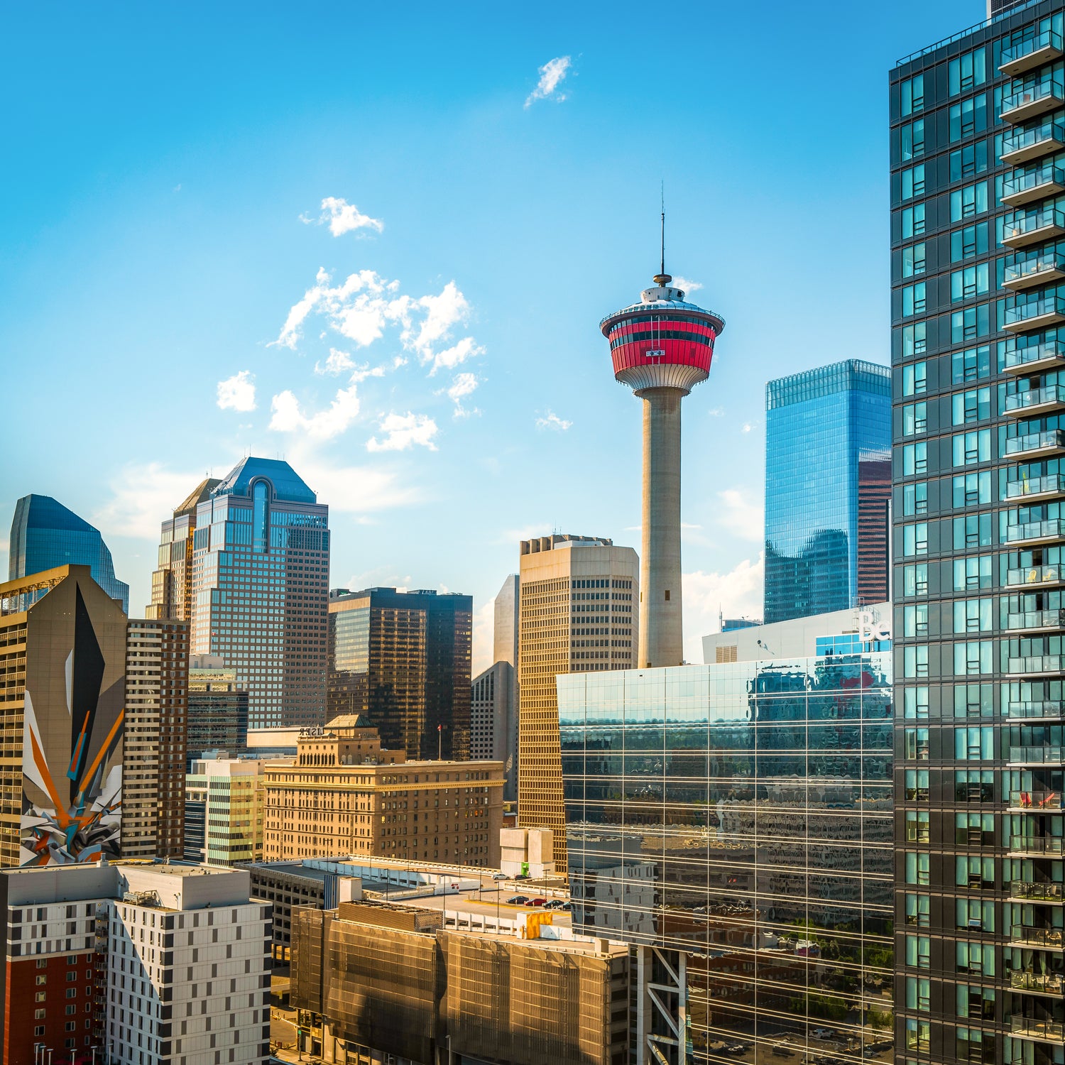 Calgary downtown skyline with the Calgary Tower rising high against a blue sky